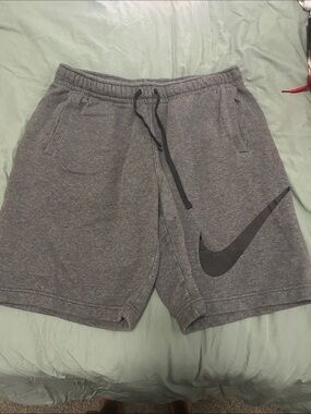 Nike Gray Athletic Shorts with Black Swoosh Logo